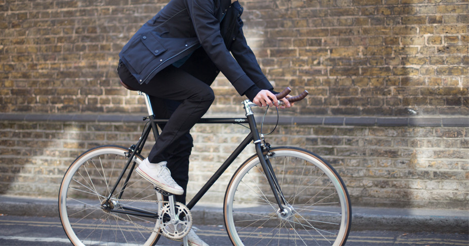 Cyclist riding a their FE Street fixed gear bike whilst wearing Fox Wilson preston jeans and black portman