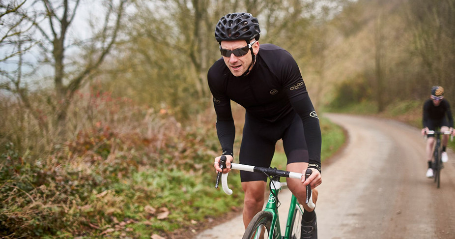 Cyclist riding his Green Venturi wearing his full team kit