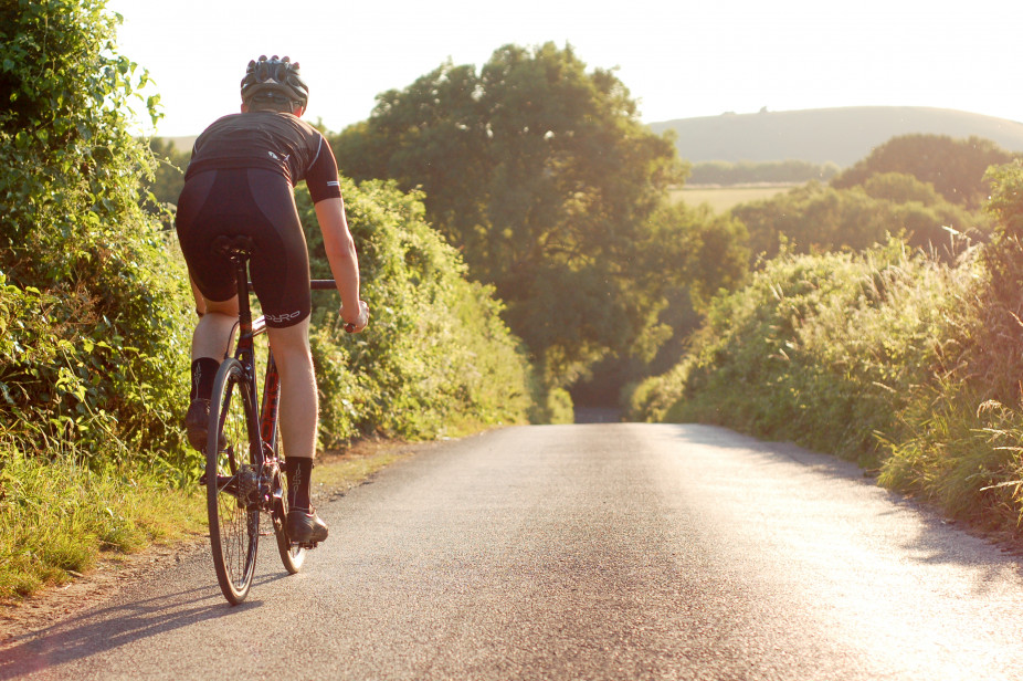 Cyclist Wearing The Team Orro Kit Whilst Desending Down A Hill On His Orro Bike