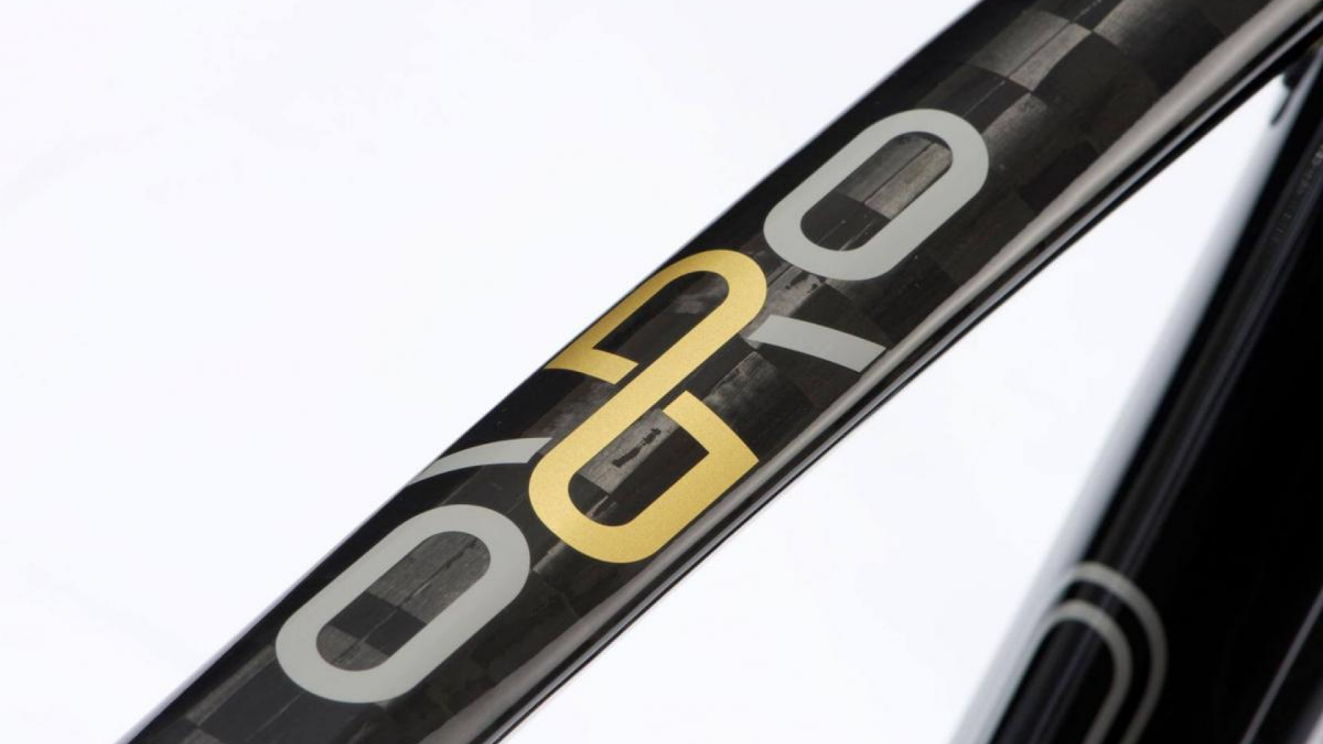 Closeup photography of the Orro logo on a carbon bike frame